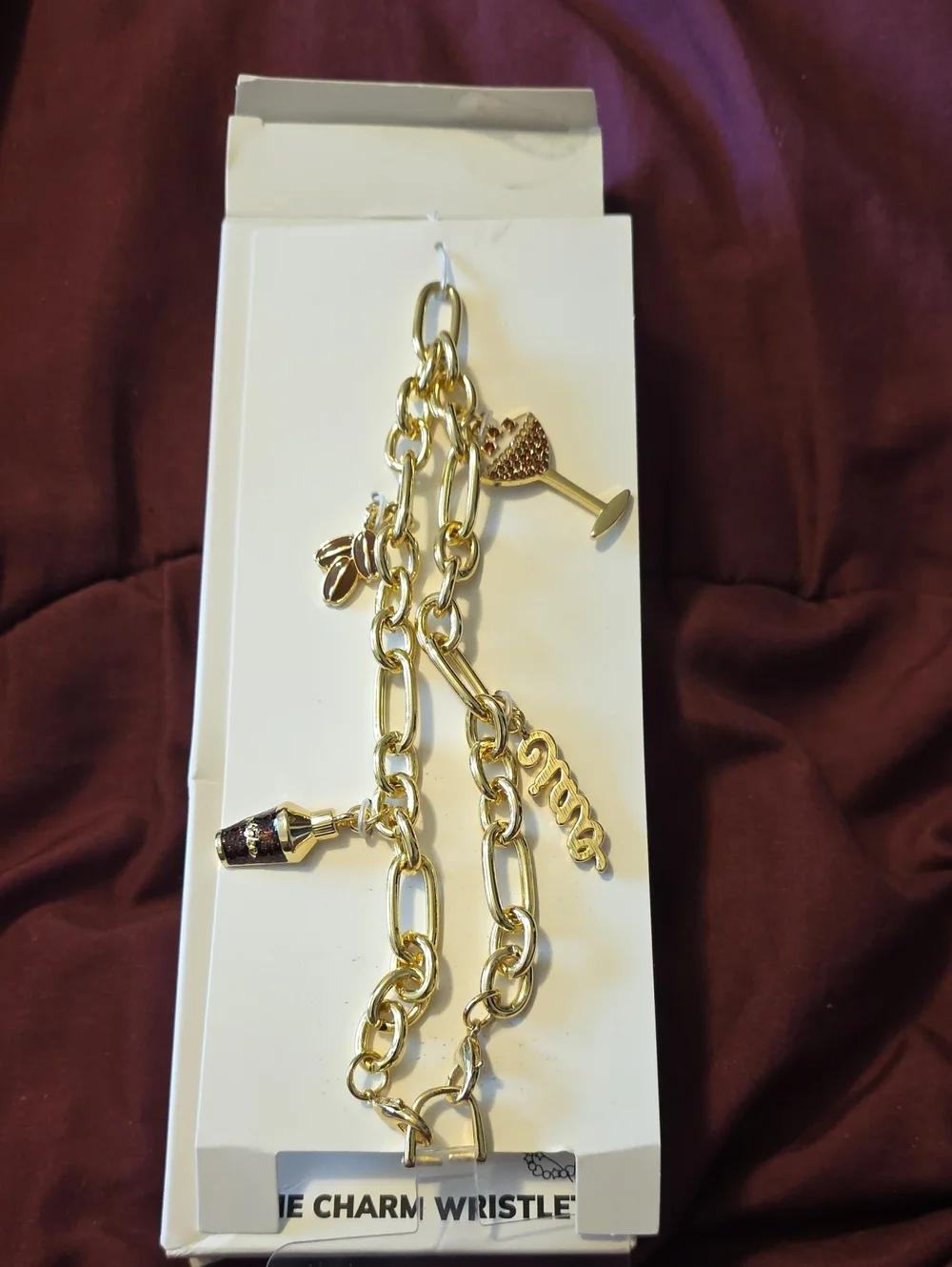 BaubleBar Gold Charm Phone Wristlet